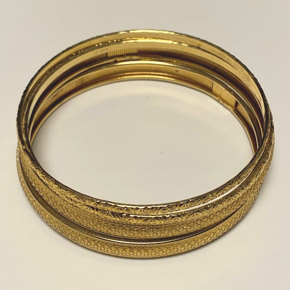 Set of 4 gold tone bangle bracelets